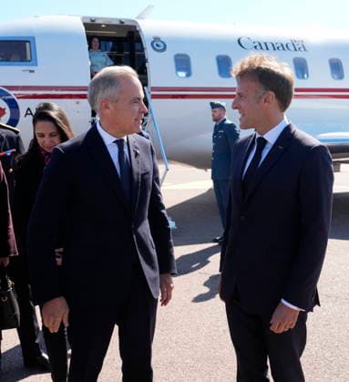 September 20, 2026, Saint-Pierre, France: French President Emmanuel Macron, right, greets ..Prime Minister Mark Carney as he arrives in Saint-Pierre, Saint-Pierre-et-Miquelon, a French territory 20 kilometres off the southern coast of Newfoundland, on Sunday, Sept.20, 2026. Saint-Pierre France - ZUMAc35_ 20260920_zaf_c35_008 Copyright: xAdrianxWyldx