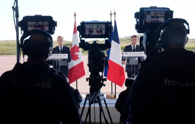 September 20, 2026, Saint-Pierre, France: French President Emmanuel Macron, right, and Prime Minister Mark Carney are seen as they deliver statements in Saint-Pierre, Saint-Pierre-et-Miquelon, a French territory 20 kilometres off the southern coast of Newfoundland, on Sunday, Sept.20, 2026. Saint-Pierre France - ZUMAc35_ 20260920_zaf_c35_074 Copyright: xAdrianxWyldx