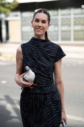 September 20, 2026, London, Camden, United Kingdom: An attendee arrives wearing a black dress and carrying a plastic pigeon at the Erdem catwalk show, held at the Roundhouse in Camden, London, as part of London Fashion Week 2026. Models and members of the fashion industry gather at the Roundhouse in Camden, London, for the Erdem catwalk show during London Fashion Week 2026. The event forms part of the official London Fashion Week schedule, bringing together models, designers, fashion professionals, media and guests for the presentation of Erdem s latest collection. London United Kingdom - ZUMAs197 20260920_aaa_s197_351 Copyright: xJamesxWilloughbyx