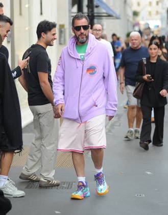 RECORD DATE NOT STATED IPA88808758 - Milan, photo by Mimmo Carriero—After stopping by Bacaro, a restaurant on Via Montenapoleone, Adam Sandler strolls through the streets of downtown. He is recognized immediately, and people ask him for photos and autographs, which he grants without hesitation. His wife Jackie follows him at a distance so as not to be recognized or photographed, and after entering the hotel—thinking no one is watching—they let themselves go, kissing and embracing before heading up to their room.  Copyright: xx xx IPA88808758