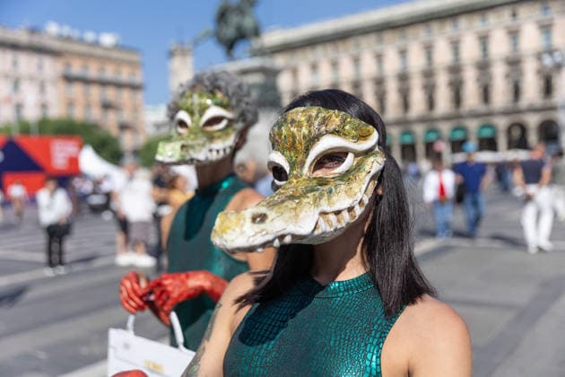 PETA’s Animal Rights Flash Mob Kicks Off Fashion Week - Milan Start of Fashion Week: a PETA animal rights flash mob featuring two women wearing crocodile masks and with their hands painted red to denounce violence against exotic animals for the production of leather shoes, belts, and handbags. Milan, Italy on September 22, 2026. Photo by fotogramma IPA ABACAPRESS.COM Milan Italy  Copyright: xFotogramma IPA ABACAx