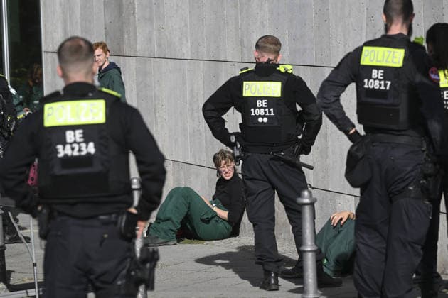 Environmental activists protest at CDU headquarters in Berlin BERLIN, GERMANY - SEPTEMBER 23: Police officers detain a ROBIN WOOD activist outside the Christian Democratic Union (CDU) headquarters during a protest in Berlin, Germany, on September 23, 2026. Police took extensive security measures around the building and detained protesters. The activists climbed the building and displayed banners criticizing the CDU-led federal government over what they described as insufficient action on climate protection and a lack of measures to counter the rise of the Alternative for Germany (AfD). Halil Sagirkaya Anadolu Berlin Germany. Editorial use only. Please get in touch for any other usage.  Copyright: x2026xAnadoluxHalilxSagirkayax