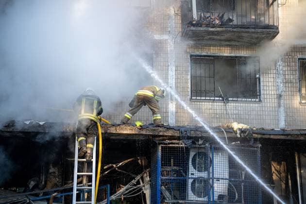 September 26, 2026, Kyiv, Ukraine: KYIV, UKRAINE, SEPTEMBER 26, 2026: Firefighters work at a five-story residential building damaged during a Russian drone attack in KyivÃ¢â‚¬â ¢s Solomianskyi district, as residents watch emergency operations and clear shattered glass from the area. Kyiv authorities said a fire broke out at the residential building and a ground-floor shop following the fall of a drone, injuring four people and prompting rescuers to evacuate 20 residents. Kyiv Ukraine  - ZUMAq101 20260926_zna_q101_099 Copyright: xNastassiaxKantorowiczxTorresx