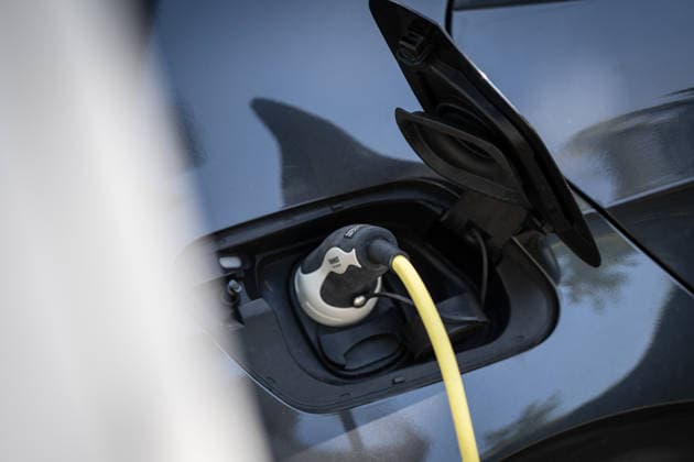 A car is being charged at a charging station operated by Stadtwerke Rostock on the side of the road in Rostock-Warnemünde. A car is being charged at a charging station operated by Stadtwerke Rostock on the side of the road in Rostock-Warnemünde, Rostock, Mecklenburg-Western Pomerania, Germany, Warnemünde