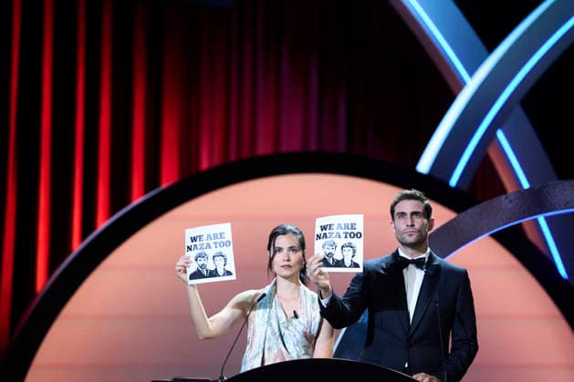 San Sebastian - Closing Ceremony Loreto Mauelon, Fernando Guallar attended Closing Ceremony Gala during 74th San Sebastian International Film Festival at Kursaal Palace on September 26, 2026 in Donostia San Sebastian, Spain Loreto Mauelon, Fernando Guallar poses with a ‘We Are Naza Too’ poster Photo by ABACAPRESS.COM Donostia San Sebastian Euskadi Spain  Copyright: xABACAx