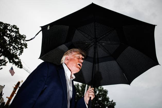 DC: President Trump Departs the White House President Donald Trump holds an umbrella as he speaks to the press before departing from the new South Lawn helipad in Marine One at the White House on September 27, 2026 in Washington, D.C. Trump is heading to Medinah, Illinois where he will be attending the PGA Tour President’s Cup. (Photo by Samuel Corum Pool ABACAPRESS.COM) Washington DC United States  Copyright: xPool ABACAx