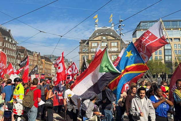 NETHERLANDS, AMSTERDAM - SEPTEMBER 27, 2026: Activists wave flags during a rally against militarisation and for peace with Russia in Dam Square. Natalya Blinova TASS  98429457