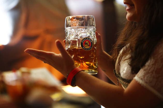 Germany world s largest beer festival Oktoberfest Attendees hold a mug of Palaner beer during the world s largest beer festival Oktoberfest in Munich, Germany, September 27th , 2026 . Photo by Davide Elias Copyright: xDavidexEliasx