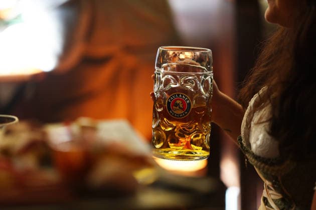 Germany world s largest beer festival Oktoberfest Attendees hold a mug of Paulaner beer during the world s largest beer festival Oktoberfest in Munich, Germany, September 27th , 2026 . Photo by Davide Elias Copyright: xDavidexEliasx