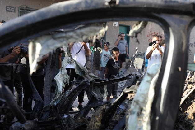 Palestinians Gather at Site of Israeli Strike in Gaza City Palestinians gather at the site of an Israeli airstrike that targeted a vehicle near al-Sinaa junction in Gaza City on September 27, 2026. The strike killed one Palestinian and wounded others, according to local sources. Photo by Bilal Osama apaimages Gaza city Gaza Strip Palestinian Territory 270926_Gaza_BO_01(7) Copyright: xapaimagesxBilalxOsamax xapaimagesx