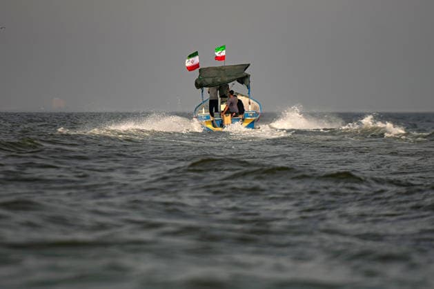 Members of Iran s paramilitary Basij Force take part in a military drill during the Janfada Iran exercise on the Iranian coast of Kandal, overlooking the Strait of Hormuz, Iran, on Sunday, September 27, 2026. The exercise comes amid continuing regional tensions and heightened security measures around the Strait of Hormuz, one of the world s most strategically important waterways.  IRN2026092720 BehnamxTofighi