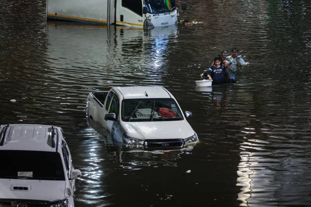 September 27, 2026, Bangkok, Bangkok, Thailand: Commuters wade through deep floodwaters along a major road after 48 hours of continuous torrential rain triggered widespread flash flooding across the capital, in Bangkok, Thailand, September 27, 2026. Bangkok Thailand  - ZUMAp219 20260927_zip_p219_080 Copyright: xNattaphonxPhanphongsanonx