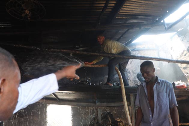 September 28, 2026, Juba, Ces Juba, South Sudan: Firefighters and residents work to extinguish a blaze that engulfed four shops at Konyo Konyo Market in Juba, South Sudan, amid reports that illegal electrical connections may have contributed to the fire. No casualties or extent of property damage have been officially confirmed. Juba South Sudan  - ZUMAb132 20260928_zip_b132_005 Copyright: xSamirxBolx