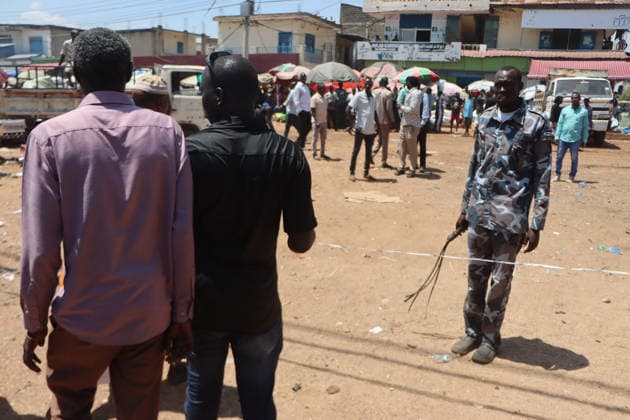 September 28, 2026, Juba, Ces Juba, South Sudan: Firefighters and residents work to extinguish a blaze that engulfed four shops at Konyo Konyo Market in Juba, South Sudan, amid reports that illegal electrical connections may have contributed to the fire. No casualties or extent of property damage have been officially confirmed..In the photo , Police officers are cordoning off the area. Juba South Sudan  - ZUMAb132 20260928_zip_b132_012 Copyright: xSamirxBolx