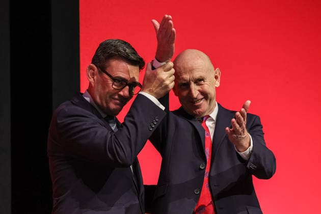 Labour Party Annual Conference Day Two Prime Minister of the United Kingdom Andy Burnham lifts the hands of Chancellor of the Exchequer John Healey MP after his speech during the Labour Party Annual Conference Day Two at Convention Centre, Liverpool, United Kingdom on 28 September 2026 (Photo by Mark Cosgrove News Images) Liverpool Convention Centre Merseyside United Kingdom Copyright: xMarkxCosgrove NewsxImagesx