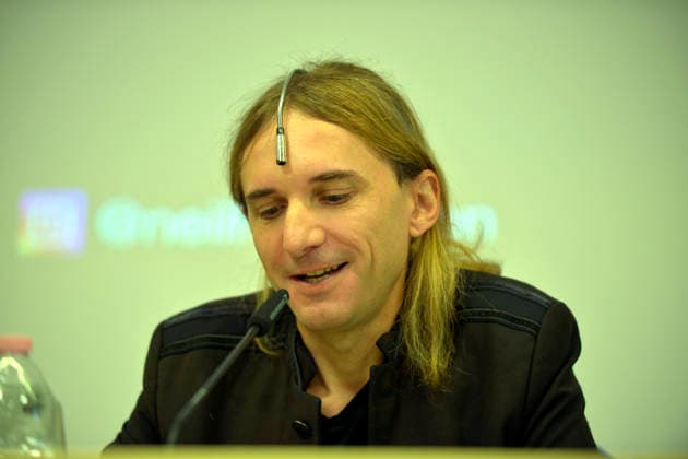 IPA89072974 - Lucca, September 28, 2026 At the San Micheletto complex as part of the Lucca Film Festival, British artist Neil Harbisson held a masterclass titled OVER THE REAL. Since 2004, Harbisson has been using an antenna implanted in his skull which has now become an organ for him that allows him to perceive the frequencies of colors, infrared, and ultraviolet light, as well as to access servers. In the photo: Neil Harbisson with his antenna.  Copyright: xRobertoCappelloxfotografox xRobertoCappelloxfotografox IPA89072974