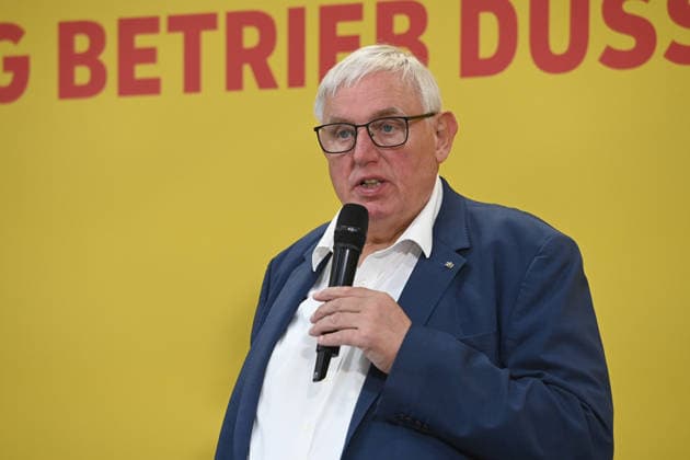 Karl Josef LAUMANN, CDU, Minister of Labor, Health, and Social Affairs for the State of North Rhine-Westphalia, during his speech. Minister Laumann visits a Deutsche Post and DHL distribution center in Düsseldorf on September 28, 2026,