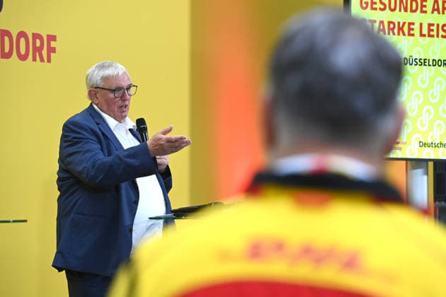 Karl Josef LAUMANN, CDU, Minister of Labor, Health, and Social Affairs for the State of North Rhine-Westphalia, during his speech. Minister Laumann visits a Deutsche Post and DHL distribution center in Düsseldorf on September 28, 2026,