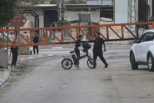 Palestinians Cross Gate Amid West Bank Movement Restrictions Palestinians cross an iron gate west of the West Bank city of Nablus on September 28, 2026, as Israeli restrictions on movement continue for a second day during the Jewish holiday of Sukkot. Israeli forces have closed a number of checkpoints and gates across the West Bank, restricting Palestinian travel between cities, towns and villages and disrupting access to workplaces and services. Photo by Mohammed Nasser apaimages Nablus West Bank Palestinian Territory 280926_Nablus_MN_00(3) Copyright: xapaimagesxMohammedxNasserx xapaimagesx