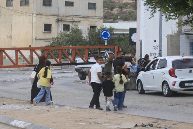 Palestinians Cross Gate Amid West Bank Movement Restrictions Palestinians cross an iron gate west of the West Bank city of Nablus on September 28, 2026, as Israeli restrictions on movement continue for a second day during the Jewish holiday of Sukkot. Israeli forces have closed a number of checkpoints and gates across the West Bank, restricting Palestinian travel between cities, towns and villages and disrupting access to workplaces and services. Photo by Mohammed Nasser apaimages Nablus West Bank Palestinian Territory 280926_Nablus_MN_00(11) Copyright: xapaimagesxMohammedxNasserx xapaimagesx