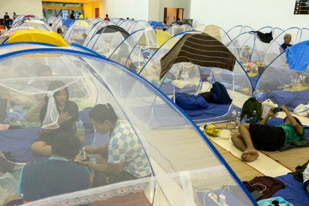 Bangkok Flooding Forces Residents Into Temporary Shelters People sit inside mosquito nets at a shelter at King Mongkut™s Institute of Technology Ladkrabang (KMITL) in Bangkok, Thailand, September 28, 2026. Flooding has forced residents to seek refuge in temporary shelters in the Thai capital. Bangkok Bangkok Thailand Copyright: xNicolaxLongobardix