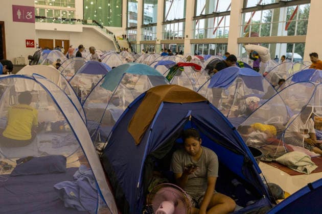 Bangkok Flooding Forces Residents Into Temporary Shelters People sit inside mosquito nets at a shelter at King Mongkut™s Institute of Technology Ladkrabang (KMITL) in Bangkok, Thailand, September 28, 2026. Flooding has forced residents to seek refuge in temporary shelters in the Thai capital. Bangkok Bangkok Thailand Copyright: xNicolaxLongobardix