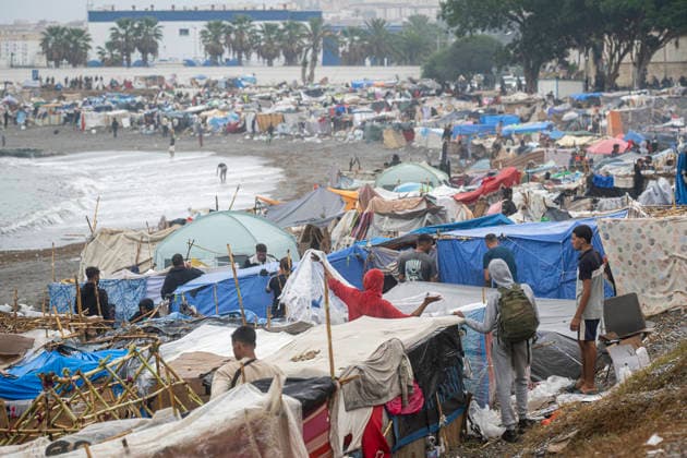 Rain Affects the El Trampolín Beach Settlements in Ceuta. Migrants try to keep their rain-damaged shacks standing on El Trampolín Beach on September 28, 2026, in Ceuta, Spain. Around 3,000 migrants remain in makeshift settlements on Ceuta’s beaches following the massive influx recorded in late July. Continuous rain is flooding the ground and damaging the shacks built with reeds, plastic, cardboard, and sheets on El Trampolín Beach. SEPTEMBER 28, 2026 Ceuta, Ceuta, Spain  Copyright: xMarcosxMorenox 7806278