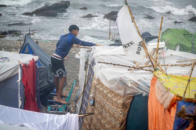 Rain Affects the El Trampolín Beach Settlements in Ceuta. Migrants try to keep their rain-damaged shacks standing on El Trampolín Beach on September 28, 2026, in Ceuta, Spain. Around 3,000 migrants remain in makeshift settlements on Ceuta’s beaches following the massive influx recorded in late July. Continuous rain is flooding the ground and damaging the shacks built with reeds, plastic, cardboard, and sheets on El Trampolín Beach. SEPTEMBER 28, 2026 Ceuta, Ceuta, Spain  Copyright: xMarcosxMorenox 7806279