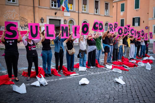 September 28, 2026, Rome, Rm, Italy: To mark International Safe Abortion Day, the feminist and transfeminist movement Non Una Di Meno (Not One Less) is holding a rally outside the Ministry of Health, reiterating their call for The right to free, safe, and accessible abortion for everyone who requests it . Protesters take off the red cloaks and white bonnets from The Handmaid s Tale as a visual symbol to defend abortion access and oppose reproductive restrictions. My body my choice reads the sign. Rome Italy  - ZUMAg256 20260928_znp_g256_016 Copyright: xMarcoxDixGianvitox