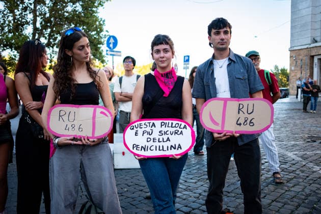 September 28, 2026, Rome, Rm, Italy: To mark International Safe Abortion Day, the feminist and transfeminist movement Non Una Di Meno (Not One Less) is holding a rally outside the Ministry of Health, reiterating their call for The right to free, safe, and accessible abortion for everyone who requests it . Some cardboard cutouts represent the abortion pill RU-486. This pill is safer than penicillin reads the sign. Rome Italy  - ZUMAg256 20260928_znp_g256_017 Copyright: xMarcoxDixGianvitox