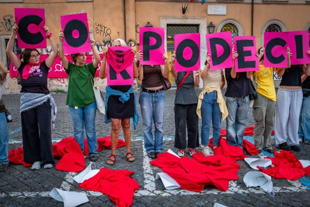 September 28, 2026, Rome, Rm, Italy: To mark International Safe Abortion Day, the feminist and transfeminist movement Non Una Di Meno (Not One Less) is holding a rally outside the Ministry of Health, reiterating their call for The right to free, safe, and accessible abortion for everyone who requests it . Protesters take off the red cloaks and white bonnets from The Handmaid s Tale as a visual symbol to defend abortion access and oppose reproductive restrictions. My body my choice reads the sign. Rome Italy  - ZUMAg256 20260928_znp_g256_019 Copyright: xMarcoxDixGianvitox