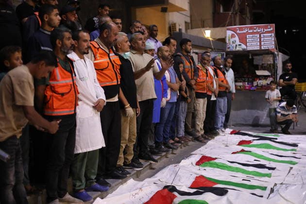 Palestinians mourn victims outside Al-Awda Hospital in central Gaza NUSEIRAT, GAZA, PALESTINE - SEPTEMBER 28: Relatives light candles and mourn over the bodies of Palestinians recovered from the rubble of destroyed homes following Israeli airstrikes on the Nuseirat refugee camp in the central Gaza Strip, Palestine, outside Al-Awda Hospital on September 28, 2026. Grieving families gathered in sorrow as search and rescue teams, civil defense workers, and local volunteers continued intensive operations amid severe destruction to locate and retrieve those trapped under collapsed concrete structures. Hassan Jedi Anadolu Nuseirat Gaza. Editorial use only. Please get in touch for any other usage.  Copyright: x2026xAnadoluxHassanxJedix