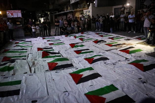 Palestinians Mourn Loved Ones Recovered From Rubble in Nuseirat Palestinians light candles and mourn beside the bodies of loved ones recovered from beneath the rubble of destroyed homes outside Al-Awda Hospital in the Nuseirat refugee camp, central Gaza Strip, on September 28, 2026. Search and rescue operations continue for people trapped beneath the rubble. Photo by Moiz Salhi apaimages Nusairat Gaza Strip Palestinian Territory 280926_Nusairat_MS_00(9) Copyright: xapaimagesxMoizxSalhixx xapaimagesx