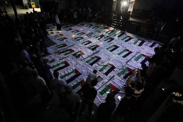 Palestinians Mourn Loved Ones Recovered From Rubble in Nuseirat Palestinians light candles and mourn beside the bodies of loved ones recovered from beneath the rubble of destroyed homes outside Al-Awda Hospital in the Nuseirat refugee camp, central Gaza Strip, on September 28, 2026. Search and rescue operations continue for people trapped beneath the rubble. Photo by Moiz Salhi apaimages Nusairat Gaza Strip Palestinian Territory 280926_Nusairat_MS_00(18) Copyright: xapaimagesxMoizxSalhixx xapaimagesx
