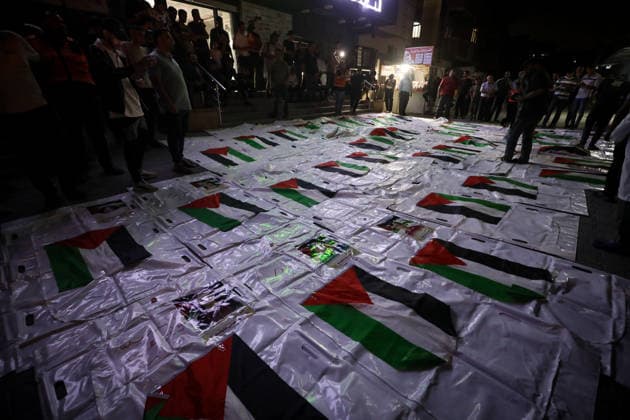 Palestinians Mourn Loved Ones Recovered From Rubble in Nuseirat Palestinians light candles and mourn beside the bodies of loved ones recovered from beneath the rubble of destroyed homes outside Al-Awda Hospital in the Nuseirat refugee camp, central Gaza Strip, on September 28, 2026. Search and rescue operations continue for people trapped beneath the rubble. Photo by Moiz Salhi apaimages Nusairat Gaza Strip Palestinian Territory 280926_Nusairat_MS_00(21) Copyright: xapaimagesxMoizxSalhixx xapaimagesx