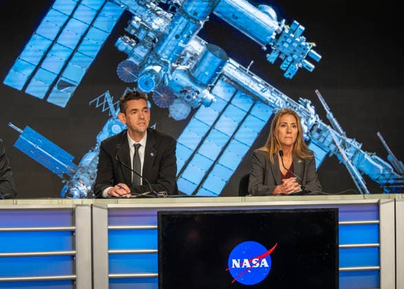 NASA Administrator Jared Isaacman (L) and NASA s Low Earth Orbit Program Manager Dana Weigel discuss an update on the Boeing Starliner Spacecraft at a news conference at Kennedy Space Center, Florida on Monday, September 28, 2026. The backdrop is a photo of the International Space Station, where the Starliner was designed to fly to but has had troubles. After a redesign, the next Starliner is expected to be launched in December.  KSC20260928111 PATxBENIC