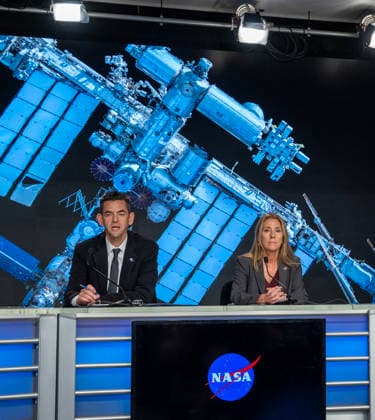 NASA Administrator Jared Isaacman (L) and NASA s Low Earth Orbit Program Manager Dana Weigel discuss an update on the Boeing Starliner Spacecraft at a news conference at Kennedy Space Center, Florida on Monday, September 28, 2026. The backdrop is a photo of the International Space Station, where the Starliner was designed to fly to but has had troubles. After a redesign, the next Starliner is expected to be launched in December.  KSC20260928140 PATxBENIC