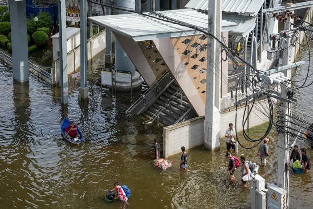 September 28, 2026, Bangkok, Thailand: A view of a metro entrance as people walk or use boats through the floodwater to reach it on Lat Phrao Road in Bang Kapi District. On September 26, all 50 districts of Bangkok were declared disaster-affected areas. Three days later, floodwaters still remained in parts of the city. In heavily affected areas such as Bang Kapi District, residents remained in floodwater. Bangkok Thailand - ZUMAs197 20260928_aaa_s197_358 Copyright: xNathaliexJamoisx