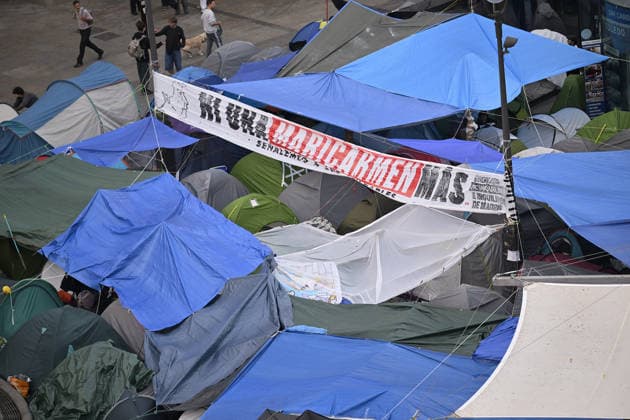 Tent protest continues against housing crisis in Spain MADRID, SPAIN - SEPTEMBER 29 : Protesters continue their tent-city demonstration at Sol Square, demanding solutions from central and regional governments to combat the country s housing crisis, following the court-ordered and police-enforced eviction on September 23 of 87-year-old Mari Carmen, a symbolic figure who became unable to afford the rent on her 70-year residence on September 29, 2026 in Madrid, Spain. Burak Akbulut Anadolu Madrid Spain. Editorial use only. Please get in touch for any other usage.  Copyright: x2026xAnadoluxBurakxAkbulutx