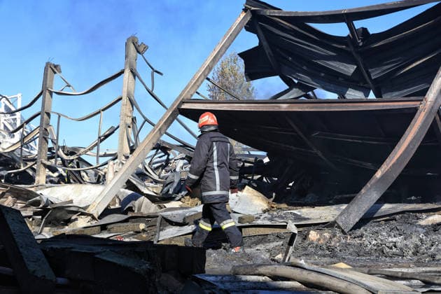 A rescuer works at a civilian industrial facility producing plastic tableware, damaged by a fire caused by a nighttime Russian drone strike in the Odesa region, Ukraine, September 29, 2026. (Photo by Nina Liashonok Ukrinform) Manufacturing plant burns down in Odesa region due to Russian drone attack  Copyright: xNinaxLiashonokx