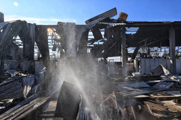 A State Emergency Service rescuer pours water on inner structures and smouldering fragments in a shop at a civilian industrial facility producing plastic tableware, damaged by a nighttime Russian drone strike in the Odesa region, Ukraine, September 29, 2026. (Photo by Nina Liashonok Ukrinform) Manufacturing plant burns down in Odesa region due to Russian drone attack  Copyright: xNinaxLiashonokx