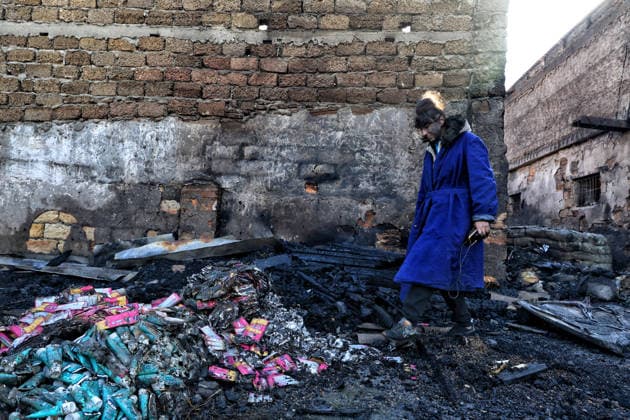 Olha Shylimina, head of the Loving Hearts animal shelter, examines the charred remains of pet food at the shelter’s destroyed main building in the Odesa region, Ukraine, September 29, 2026. During a nighttime Russian drone strike, the roof of the building - covering more than 400 square metres - was hit. The fire destroyed the premises along with stocks of grain, medicines, warm blankets, bowls, and other critical supplies. Thirteen animals - 10 cats and three dogs - died as a result of the strike and ensuing fire. (Photo by Nina Liashonok Ukrinform) Russia strikes animal shelter near Odesa  Copyright: xNinaxLiashonokx