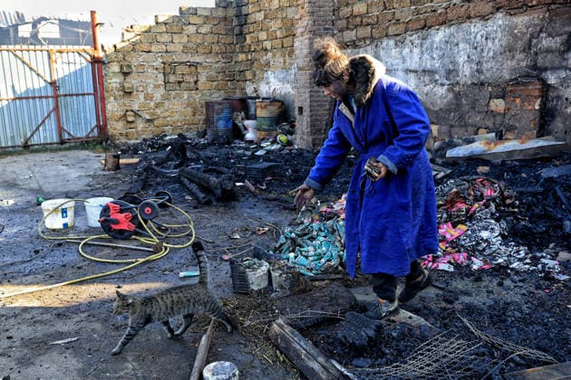 Olha Shylimina, head of the Loving Hearts animal shelter, calls a rescued cat against the backdrop of the scorched stone walls of the shelter’s destroyed main building in the Odesa region, Ukraine, September 29, 2026. During a nighttime Russian drone strike, the roof of the building - covering more than 400 square metres - was hit. The fire destroyed the premises along with stocks of grain, medicines, warm blankets, bowls, and other critical supplies. Thirteen animals - 10 cats and three dogs - died as a result of the strike and ensuing fire. (Photo by Nina Liashonok Ukrinform) Russia strikes animal shelter near Odesa  Copyright: xNinaxLiashonokx