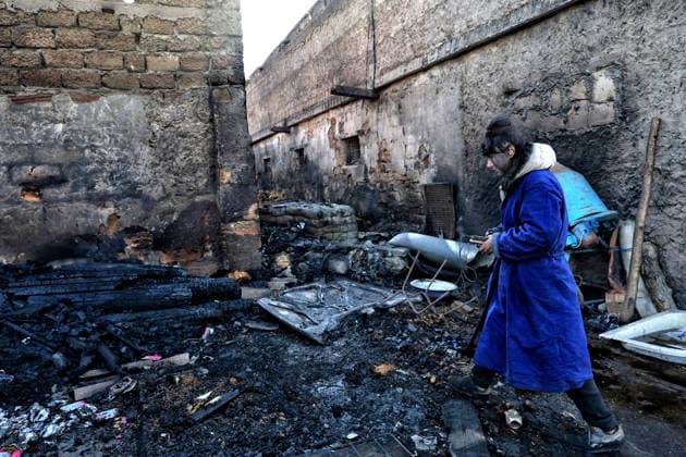 Olha Shylimina, head of the Loving Hearts animal shelter, examines the charred remains of pet food at the shelter’s destroyed main building in the Odesa region, Ukraine, September 29, 2026. During a nighttime Russian drone strike, the roof of the building - covering more than 400 square metres - was hit. The fire destroyed the premises along with stocks of grain, medicines, warm blankets, bowls, and other critical supplies. Thirteen animals - 10 cats and three dogs - died as a result of the strike and ensuing fire. (Photo by Nina Liashonok Ukrinform) Russia strikes animal shelter near Odesa  Copyright: xNinaxLiashonokx