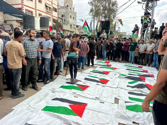 Gaza City Mass Funeral Mourners gather around bodies wrapped in shrouds during a mass funeral in Gaza City, Gaza Strip, on September 29, 2026. The remains of 43 Palestinians were recently recovered by Civil Defense crews from the rubble of a residential building destroyed in an Israeli strike earlier in the war. Gaza Gaza Strip Palestinian Territories Copyright: xDoaaxAlbazx