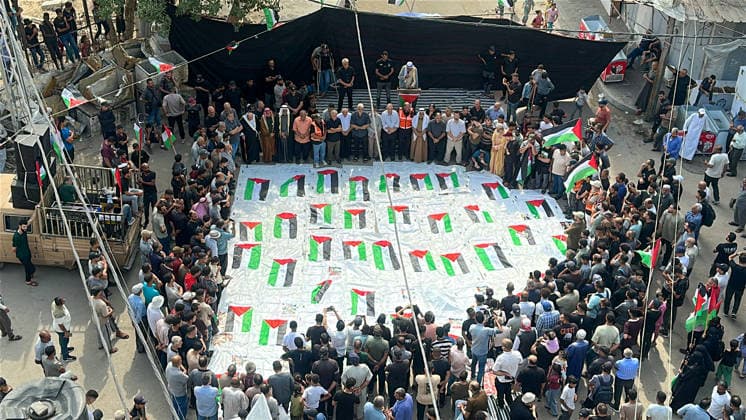 Gaza City Mass Funeral Mourners gather around bodies wrapped in shrouds during a mass funeral in Gaza City, Gaza Strip, on September 29, 2026. The remains of 43 Palestinians were recently recovered by Civil Defense crews from the rubble of a residential building destroyed in an Israeli strike earlier in the war. Gaza Gaza Strip Palestinian Territories Copyright: xDoaaxAlbazx