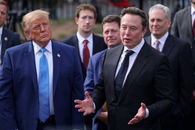 Tesla, X and SpaceX CEO Elon Musk speaks to reporters as President Donald Trump looks on outside the White House on Tuesday, September 29, 2026 in Washington, D.C. Trump held a meeting on super intelligence earlier with tech CEOs in the East Room.  WAX20260929913 TierneyxL.xCross