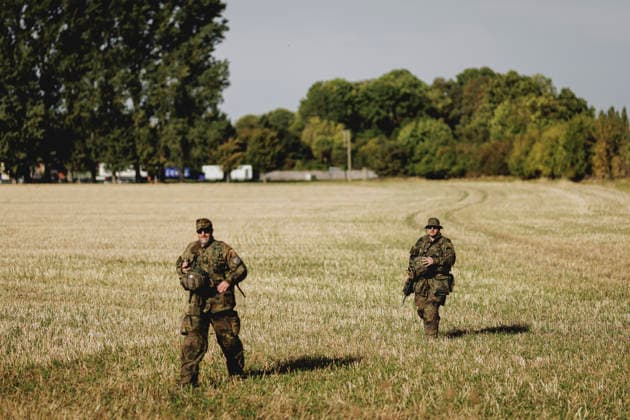 Two soldiers in a field, photographed during the Vigilant Roland II exercise conducted by the Bundeswehr’s Homeland Security Division in a public area in Stendal, September 29, 2026. As part of the exercise, the soldiers are training, among other things, in providing aid following a car accident and in preventing espionage attempts by enemy forces. Stendal, Germany Copyright: xFlorianxGaertnerx