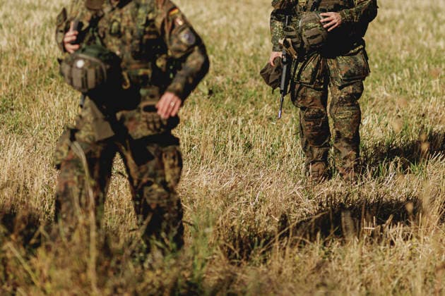 Two soldiers in a field, photographed during the Vigilant Roland II exercise conducted by the Bundeswehr s Homeland Security Division in a public area in Stendal, September 29, 2026. As part of the exercise, the soldiers are training, among other things, in providing aid after a car accident and in preventing espionage attempts by enemy forces. Stendal, Germany Copyright: xFlorianxGaertnerx