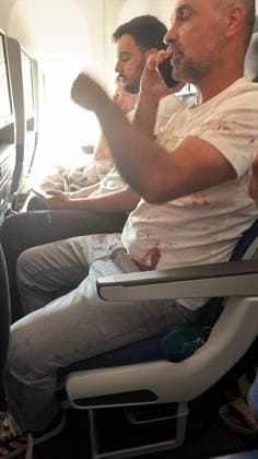 (260930) -- TEL AVIV, Sept. 30, 2026 () -- This photo released by an Israeli media agency shows a passenger with bloodstains on his clothes aboard a Flydubai commercial flight from Dubai to Tel Aviv, on Sept. 30, 2026. Israeli security agencies were investigating an incident aboard a Flydubai flight from Dubai to Tel Aviv after the aircraft transmitted an emergency signal and descended sharply before diverting to Saudi Arabia on Wednesday. () (SpotNews) ISRAEL-FLYDUBAI COCKPIT INCIDENT-INVESTIGATION Xinhua 
